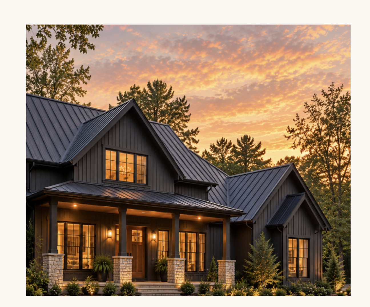 Warmly lit limestone home with charcoal roof
